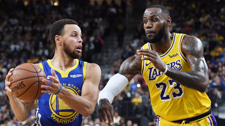 Stephen Curry of the Golden State Warriors drives against LeBron James of the Los Angeles Lakers. (Ethan Miller/Getty Images)