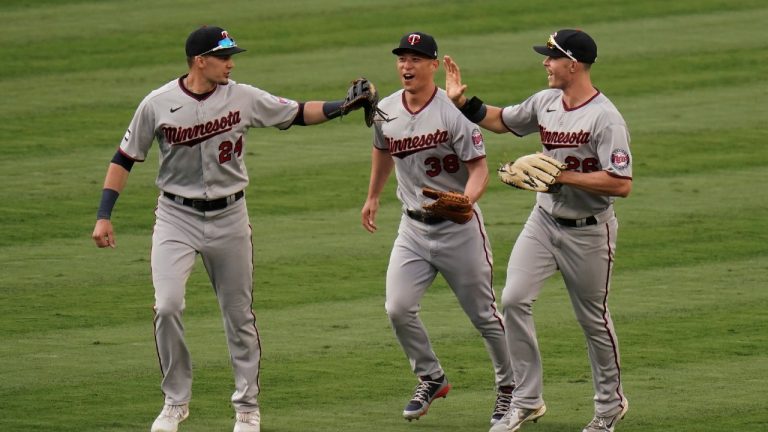 Minnesota Twins' Trevor Larnach, Rob Refsnyder and Max Kepler celebrate the team's 6-3 win against the Los Angeles Angels in the second baseball game of a doubleheader, Thursday, May 20, 2021, in Anaheim, Calif. (Jae C. Hong/AP)