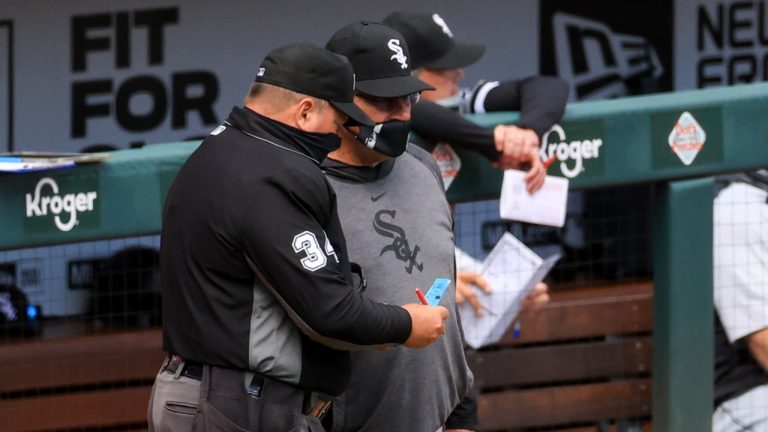 MLB umpire Sam Holbrook, left, talks with Chicago White Sox Tony La Russa during the ninth inning of a baseball game. (AP Photo/Aaron Doster)