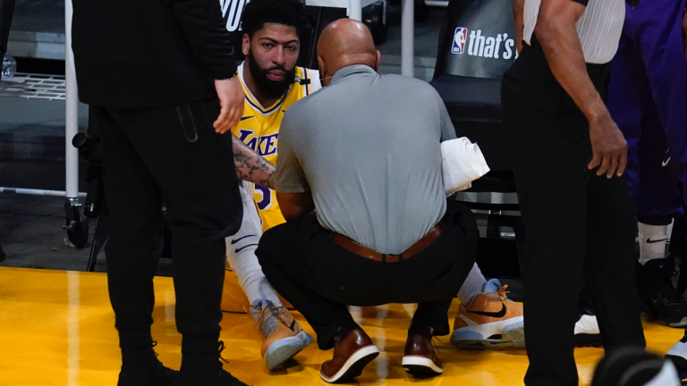 Los Angeles Lakers forward Anthony Davis (3) is checked out for injury during the first quarter of Game 6 of an NBA basketball first-round playoff series Thursday, Jun 3, 2021, in Los Angeles. Davis let the court. (Ashley Landis / AP) 