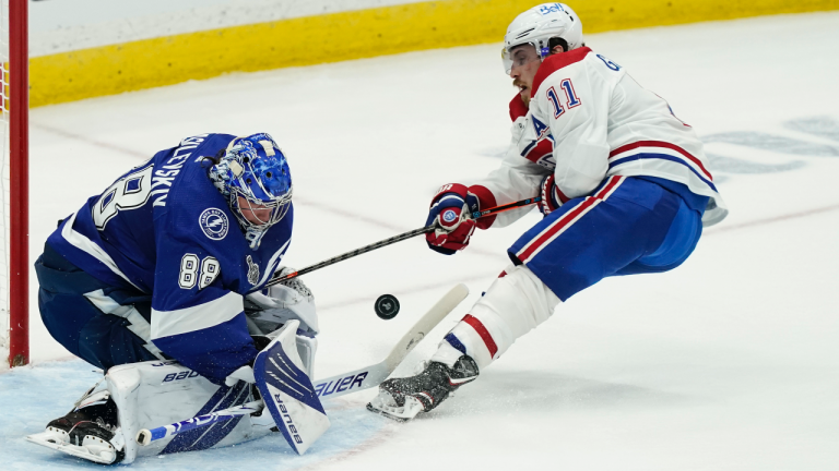 Tampa Bay Lightning goaltender Andrei Vasilevskiy (88) blocks a shot by Montreal Canadiens right wing Brendan Gallagher (11) during the second period in Game 1 of the NHL hockey Stanley Cup finals, Monday, June 28, 2021, in Tampa, Fla. (Gerry Broome / AP) 