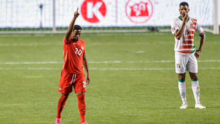 Canada's Jonathan David (20) celebrates after scoring on a penalty kick against Suriname during the second half of a World Cup 2022 Group B qualifying soccer match Tuesday, June 8, 2021, in Bridgeview, Ill. (Kamil Krzaczynski/AP)