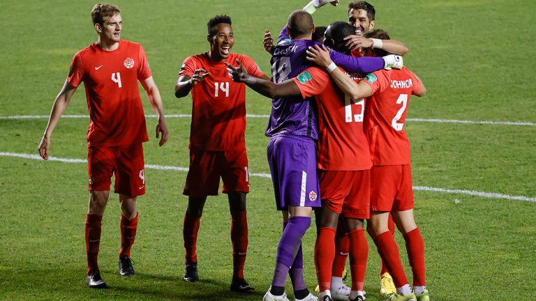 Canada players celebrate team's win 3-0 win over Haiti in a World Cup qualifying soccer match Tuesday, June 15, 2021, in Bridgeview, Ill. (Kamil Krzaczynski/AP)