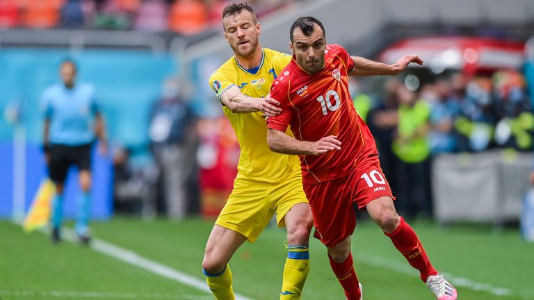 North Macedonia's Goran Pandev, right, duels for the ball with Ukraine's Andriy Yarmolenko during the Euro 2020 soccer championship group C match between Ukraine and North Macedonia at the National Arena stadium in Bucharest, Romania, Thursday, June 17, 2021. (Justin Setterfield, Pool via AP)