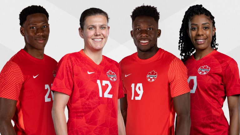 Canadian soccer players Jonathan David, left to right, Christine Sinclair, Alphonso Davies and Ashley Lawrence wear their new Canada jerseys in this undated handout photo. (Canada Soccer / CP)