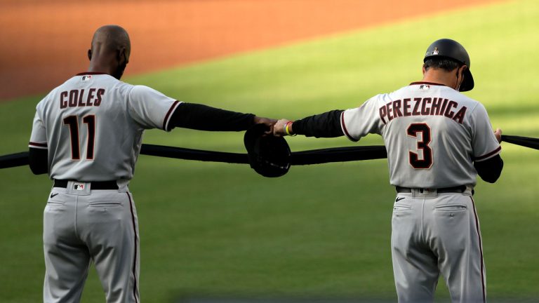 Arizona Diamondbacks hitting coach Darnell Coles, left, reacts with third base coach Tony Perezchica. (Gregory Bull/AP) 