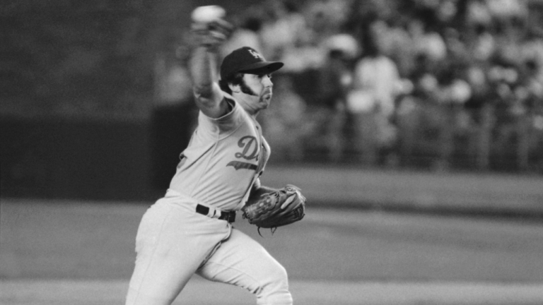 In this August 1974 file photo, Los Angeles Dodgers pitcher Mike Marshall throws to a New York Mets batter during a baseball game in New York. (Richard Drew / AP)