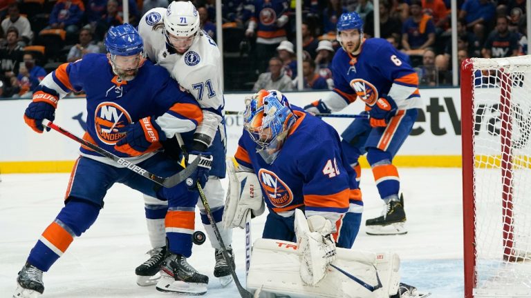 New York Islanders defenceman Andy Greene (4) and Tampa Bay Lightning centre Anthony Cirelli (71) fight for control. (Frank Franklin II/AP)