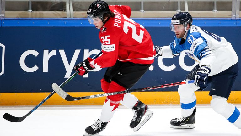 Canada's Owen Power (L) and Finland's Iiro Pakarinen in their 2021 IIHF World Championship Group B ice hockey match at Arena Riga. (Natalia Fedosenko/TASS )