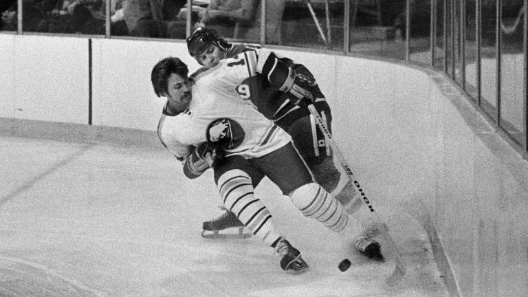 In this Dec. 12, 1977, file photo, Buffalo Sabres' Rene Robert (14), front, beats Vancouver Canucks' Don Lever (9) to the puck during first period of an NHL hockey game in Buffalo, N.Y. (AP)