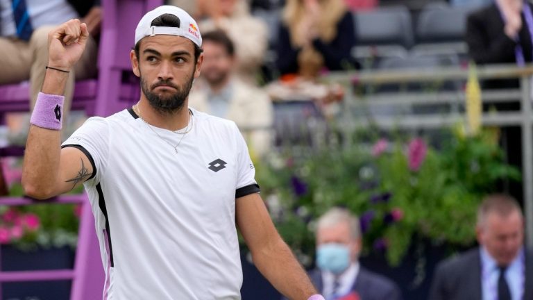 Matteo Berrettini of Italy celebrates winning at match point against Alex de Minaur of Australia during their semifinal singles tennis match at the Queen's Club tournament in London, Saturday, June 19, 2021. (Kirsty Wigglesworth/AP) 