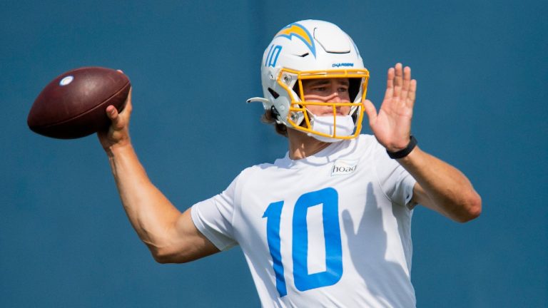 Los Angeles Chargers quarterback Justin Herbert (10) throws a pass during NFL football practice Tuesday, June 15, 2021, in Costa Mesa, Calif. (Kyusung Gong/AP) 