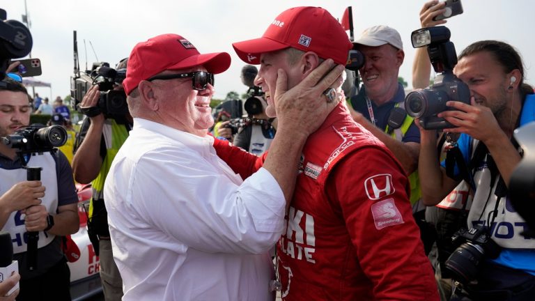 Marcus Ericsson, right, of Sweden, celebrates with team owner Chip Ganassi after winning the first race of the IndyCar Detroit Grand Prix auto racing doubleheader on Belle Isle in Detroit, Saturday, June 12, 2021. (Paul Sancya/AP) 