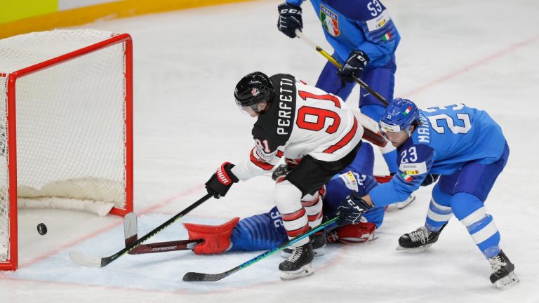 Cole Perfetti scores his side's opening goal during the Ice Hockey World Championship group B match between Italy and Canada at the Arena in Riga, Latvia, Sunday, May 30, 2021. (Sergei Grits/AP)