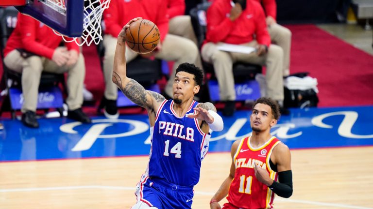 Philadelphia 76ers' Danny Green left, goes up for a shot past Atlanta Hawks' Trae Young during the first half of Game 2 in a second-round NBA basketball playoff series, Tuesday, June 8, 2021, in Philadelphia. (Matt Slocum/AP) 
