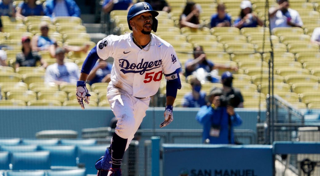 Walker Buehler drives a solo home run 