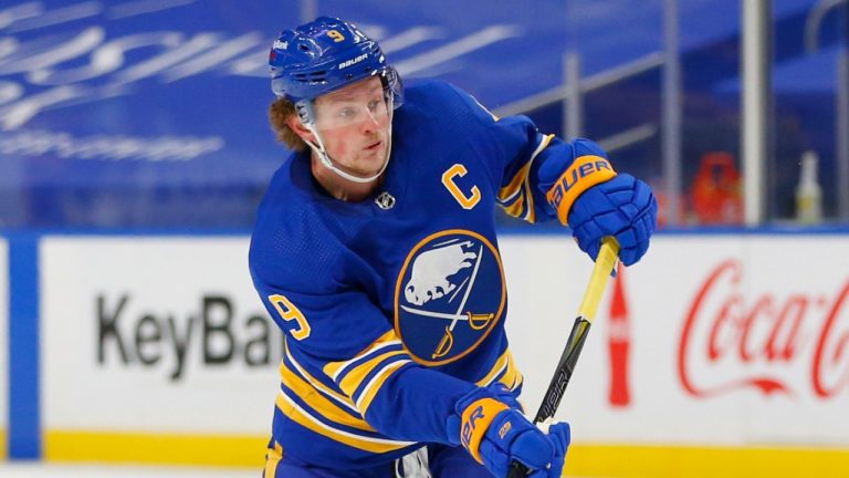 Buffalo Sabres forward Jack Eichel (9) takes a shot during the second period of an NHL hockey game against the New York Islanders, Tuesday, Feb. 16, 2021, in Buffalo, N.Y. (Jeffrey T. Barnes/AP) 