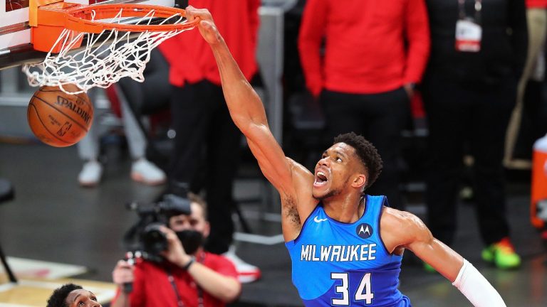 Milwaukee Bucks forward Giannis Antetokounmpo slams. (Curtis Compton/Atlanta Journal-Constitution via AP)