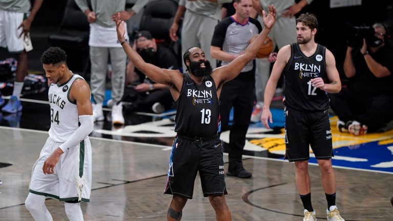 Brooklyn Nets guard James Harden (13) encourages the crowd to get behind the team during the final minutes of Game 5 of a second-round playoff series against the Milwaukee Bucks, Tuesday, June 15, 2021, in New York. (Kathy Willens/AP) 