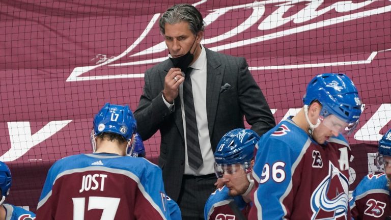 Colorado Avalanche head coach Jared Bednar, top, directs his players during a timeout against the St. Louis Blues in the second period of Game 1 of an NHL hockey Stanley Cup first-round playoff series Monday, May 17, 2021, in Denver. (David Zalubowski/AP) 