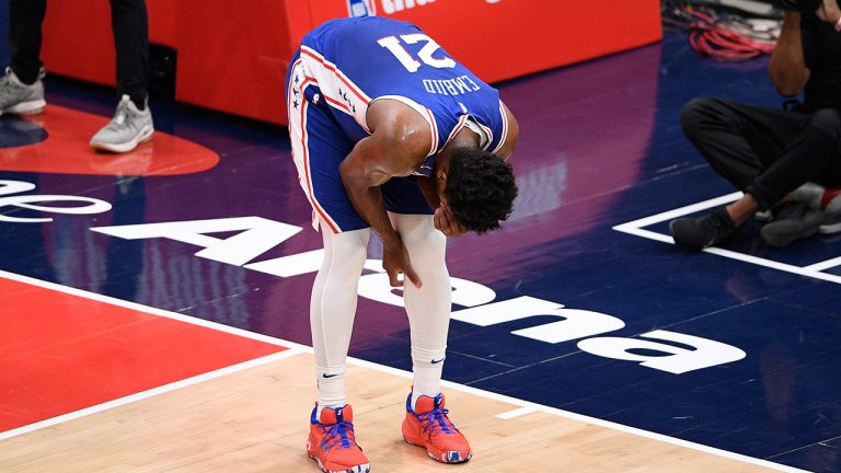 Philadelphia 76ers centre Joel Embiid (21) reacts after he fell on the court during the first half of Game 4. (Nick Wass/AP) 