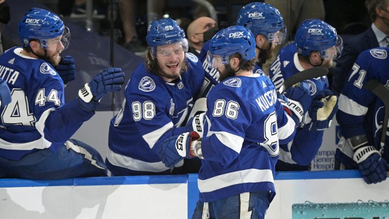 Tampa Bay Lightning right wing Nikita Kucherov (86) celebrates his goal with teammates during the third period in Game 1 of the NHL hockey Stanley Cup finals against the Montreal Canadiens, Monday, June 28, 2021, in Tampa, Fla. (Phelan Ebenhack/AP) 