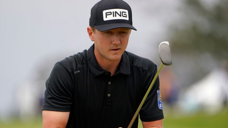 Mackenzie Hughes, of Canada, lines up his shot on the second green during the third round of the U.S. Open Golf Championship. (Jae C. Hong/AP) 