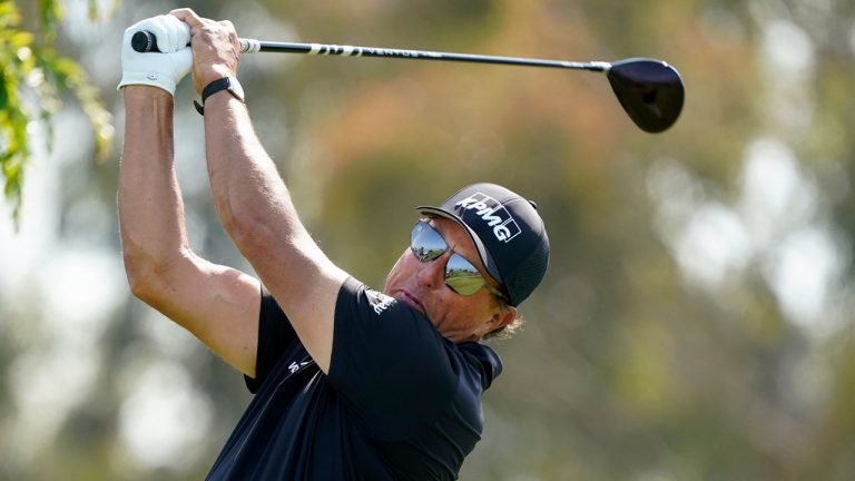 Phil Mickelson plays his shot from the 12th tee during the first round of the U.S. Open Golf Championship. (Marcio Jose Sanchez/AP) 