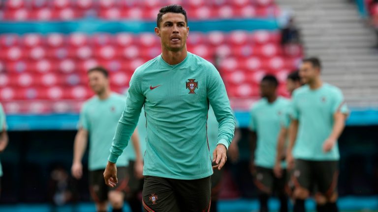 Portugal's Cristiano Ronaldo warms up prior to the start of the Euro 2020 soccer championship group F match between Hungary and Portugal at the Ferenc Puskas stadium in Budapest, Hungary Monday, June 15, 2021. (Darko Bandic/AP) 