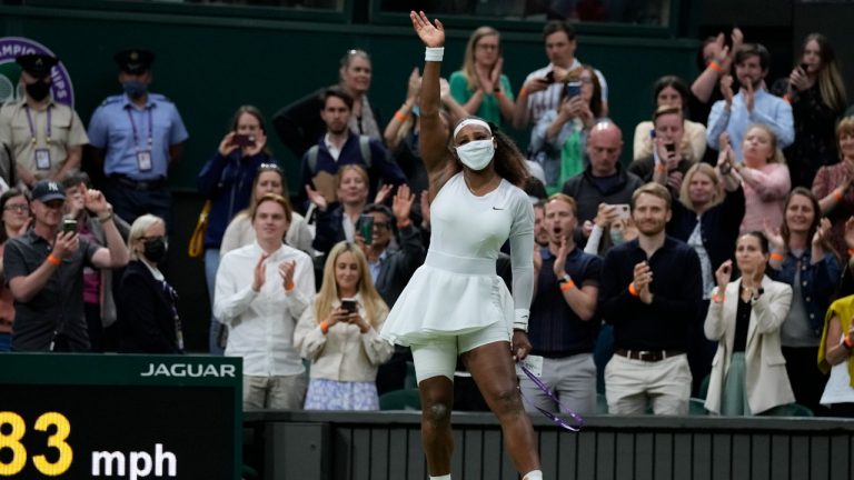 Serena Williams waves as she leaves the court after retiring from the women's singles first round match against Aliaksandra Sasnovich on day two of the Wimbledon Tennis Championships in London, Tuesday June 29, 2021. (Kirsty Wigglesworth/AP) 