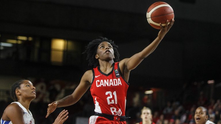 Canada's Shaina Pellington (21) goes up for the shot as Dominican Republic's Genesis Evangelista (7) tries to defend during first half action of FIBA Women's Olympic Pre Qualifying Tournaments Americas 2019, in Edmonton, Alta., on Sunday, November 17, 2019. (Jason Franson/CP)