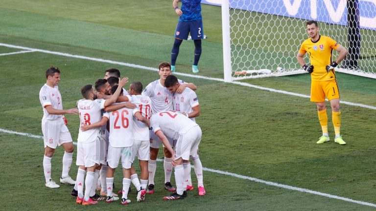 Spain players celebrate after Slovakia's Juraj Kucka scored an own-goal, Spain's 5th during the Euro 2020 soccer championship group E match between Slovakia and Spain at La Cartuja Stadium in Seville, Spain, Wednesday June. 23, 2021. (Julio Munoz, Pool Photo via AP) 