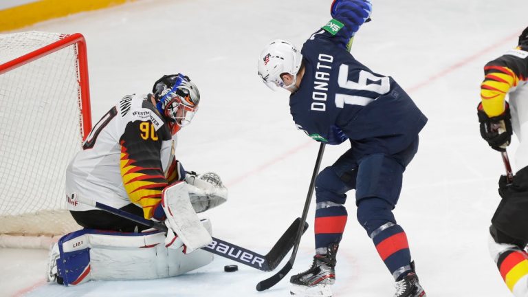 Ryan Donato of the US, centre, tries to score past Germany's goaltender Felix Bruckmann during the Ice Hockey World Championship third place match between the United States and Germany at the Arena in Riga, Latvia, Sunday, June 6, 2021. (Sergei Grits/AP)