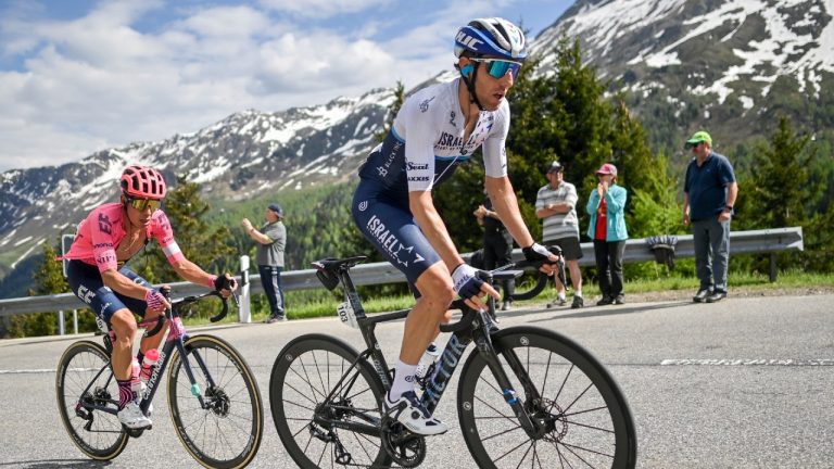 Michael Woods from Canada of Israel Start-Up-Nation, right, climbs the Lukmanier pass ahead of Rigoberto Uran from Colombia of Ef Education-Nippo during the sixth stage, a 130 km race from Andermatt to Disentis-Sedrun, at the 84th Tour de Suisse UCI ProTour cycling race, on Friday, June 11, 2021. (Gian Ehrenzeller/Keystone via AP) 