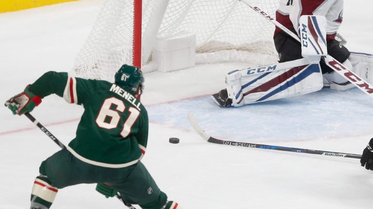 Colorado Avalanche goalie Jonathan Bernier and Andrei Mironov, right, team up too stop a shot by against the Minnesota Wild' Brennan Menell, left, during the third period of a NHL preseason hockey game, Saturday, Sept. 23, 2017, in St. Paul, Minn. The Wild won 2-1. (AP Photo/Jim Mone) 