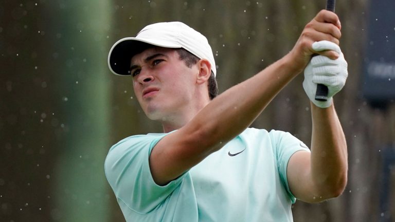 Davis Thompson drives on the fifth green during the first round of the Rocket Mortgage Classic golf tournament. (Carlos Osorio/AP) 