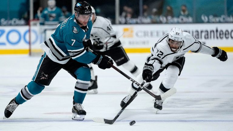 San Jose Sharks center Dylan Gambrell (7) vies for the puck against Los Angeles Kings left wing Andreas Athanasiou (22) during the first period of an NHL hockey game Saturday, April 10, 2021, in San Jose, Calif. (Tony Avelar/AP)