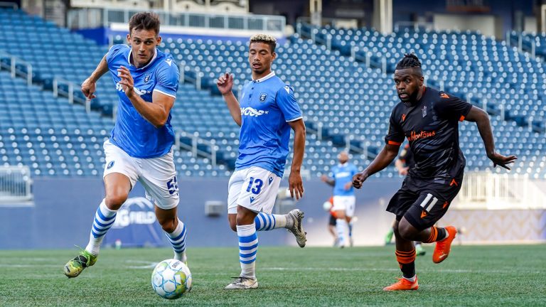 Amer Didic chases the loose ball as Chris Nanco defends. (Robert Reyes/William Ludwick/Canadian Premier League)