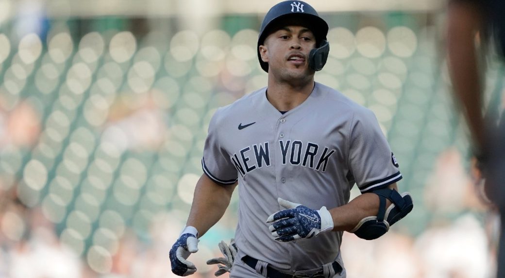 New York Yankees' Giancarlo Stanton rounds the bases after hitting