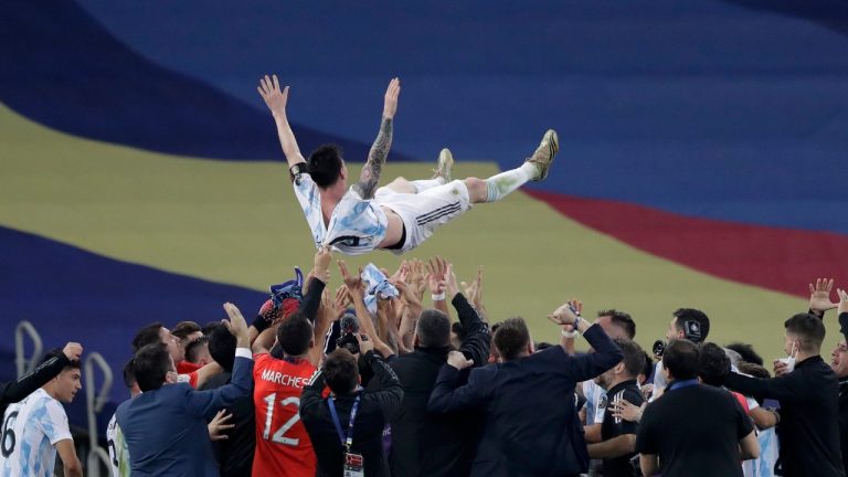 Argentina's team throw Lionel Messi up in the air as they celebrate after beating 1-0 Brazil in the Copa America final. (Andre Penner/AP)