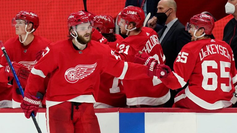 Detroit Red Wings center Michael Rasmussen (27) greets teammates after his empty-net goal during the third period of an NHL hockey game against the Chicago Blackhawks, Thursday, April 15, 2021, in Detroit. (Carlos Osorio/AP)