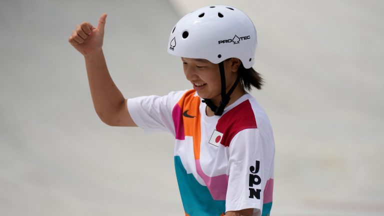 Momiji Nishiya of Japan reacts after completing a trick in the women's street skateboarding finals at the 2020 Summer Olympics, Monday, July 26, 2021, in Tokyo, Japan. (Ben Curtis/AP)