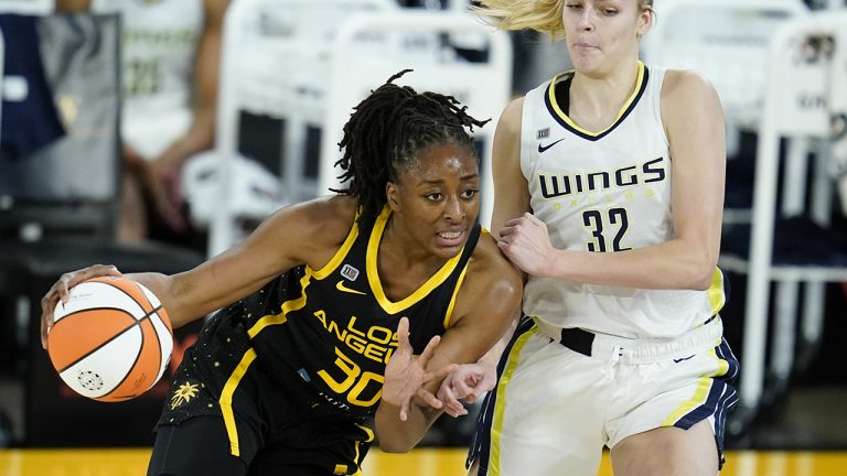 Dallas Wings center Bella Alarie (32) defends against Los Angeles Sparks forward Nneka Ogwumike (30) during the second quarter of a WBNA basketball game. (Ashley Landis/AP)