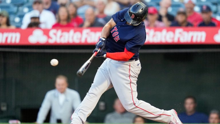 Boston Red Sox's Rafael Devers (11) singles during the second inning of a baseball game against the Los Angeles Angels Monday, July 5, 2021, in Anaheim, Calif. Marwin Gonzalez scored. (Ashley Landis/AP)