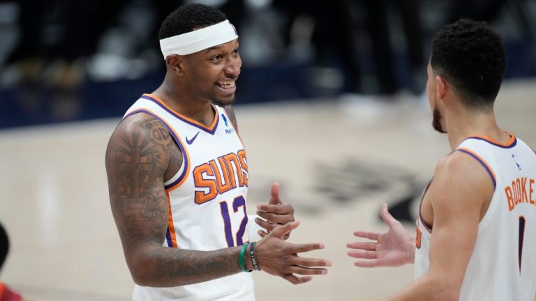 Phoenix Suns forward Torrey Craig, left, is listed as probable to play in Game 3 of the NBA Finals. (David Zalubowski/AP)