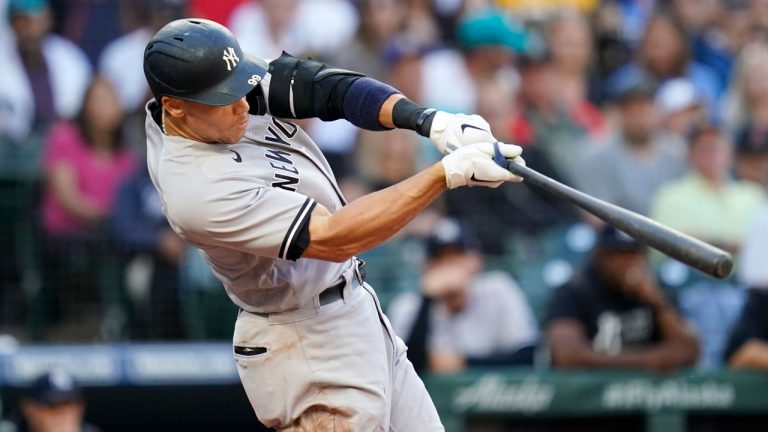 New York Yankees' Aaron Judge hits a two-run home run against the Seattle Mariners. (Elaine Thompson/AP) 