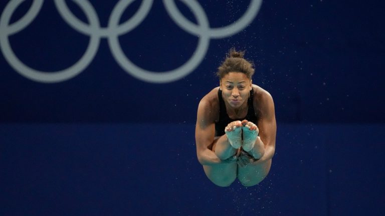 Jennifer Abel of Canada competes in women's diving 3m springboard preliminary at the Tokyo Aquatics Centre at the 2020 Summer Olympics, Friday, July 30, 2021, in Tokyo, Japan. (Dmitri Lovetsky/AP)