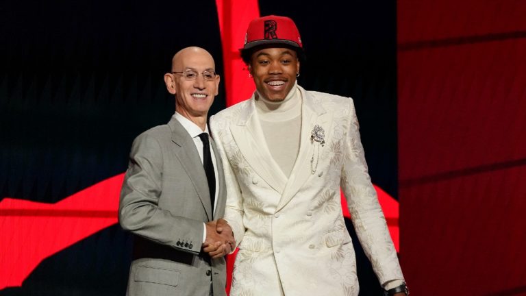 Scottie Barnes, right, poses for a photo with NBA Commissioner Adam Silver after being selected fourth overall by the Toronto Raptors during the first round of the NBA basketball draft, Thursday, July 29, 2021, in New York. (Corey Sipkin/AP)