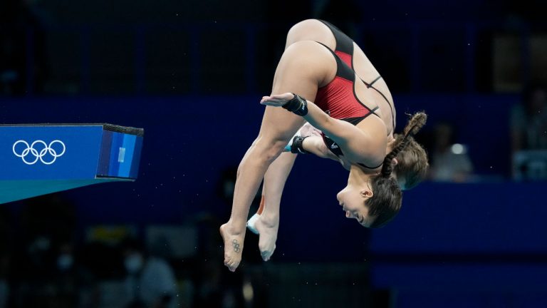 Meaghan Benfeito and Caeli Mckay of Canada compete during the women's synchronized 10m platform diving final at the Tokyo Aquatics Centre at the 2020 Summer Olympics. (Dmitri Lovetsky/AP) 