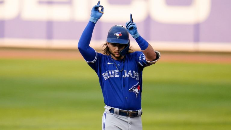 Toronto Blue Jays' Bo Bichette reacts after hitting a single off Baltimore Orioles starting pitcher Spenser Watkins during the first inning of a baseball game, Tuesday, July 6, 2021, in Baltimore. (Julio Cortez/AP) 
